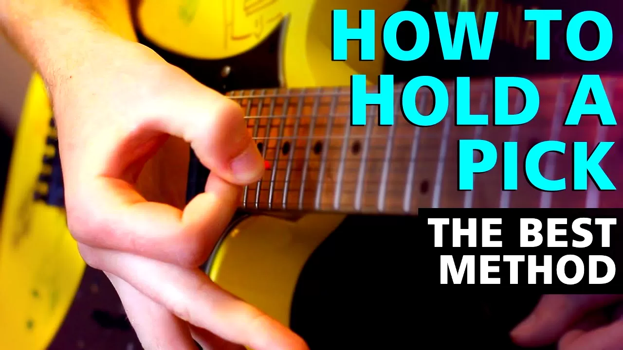 how to hold a guitar pick